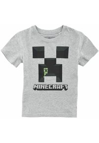Gray cotton t-shirt featuring a black pixelated creeper face graphic on the front, with the word "Minecraft" in bold, stylized letters below.
