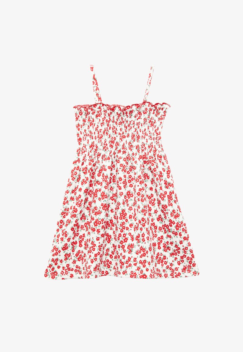 Hvid ærmeløs sommerkjole med rødt blomsterprint, smocket liv, tynde stropper og flæset halsudskæring.