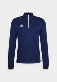 Marineblauw langemouwen kwart-rits top van gladde stof, met een witte rits en een Adidas-logo op de linkerborst.