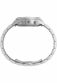 Srebrna ure iz nerjavečega jekla z okroglo ohišjem, ravnim robom in premičnim povezovalnim zapestjem. Ima dve gumbki in logo na ohišju.