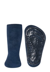 Granatowe skarpetki o miękkim, teksturowanym wykończeniu; z błyszczącą, wzorzystą podeszwą antypoślizgową dla lepszej przyczepności i stabilności.
