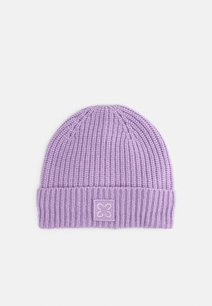 Light purple ribbed knit beanie with folded cuff and small square patch featuring a minimalist flower design centered on the cuff.