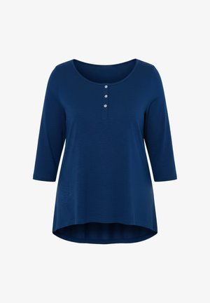 Top blu navy a maniche lunghe con scollo a giro, patta con tre bottoni e orlo curvo. Tessuto morbido e testurizzato.