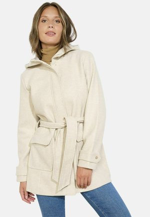 Beige belted coat with a hood, made of soft fabric. Features a zip and snap closure, two front pockets, and cuff detailing.