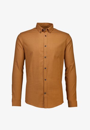 Chemise à manches longues en tissu brun terreux avec une finition texturée. Présente un col boutonné et des boutons foncés le long de l'avant.