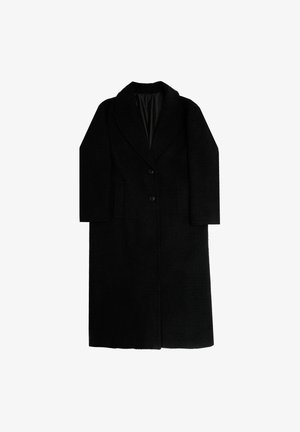 Langer schwarzer Mantel aus einem strukturierten Stoff, mit breitem Revers, zwei vorderen Taschen und einem Ein-Knopf-Verschluss. Innen mit schwarzem Stoff gefüttert.