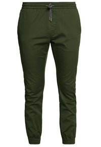 Pantalon de jogging vert olive avec une taille élastique, un cordon de serrage ajustable et des chevilles resserrées. Tissu lisse sans motifs ni ornements.