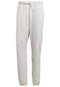 Ljusgrå fleecebyxor med elastisk midja, vit dragsko, sidofickor och elastiska muddar.