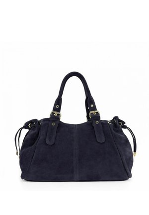 Sac à main en daim bleu foncé avec doubles poignées, boucles dorées et côtés à cordon sur fond blanc uni.