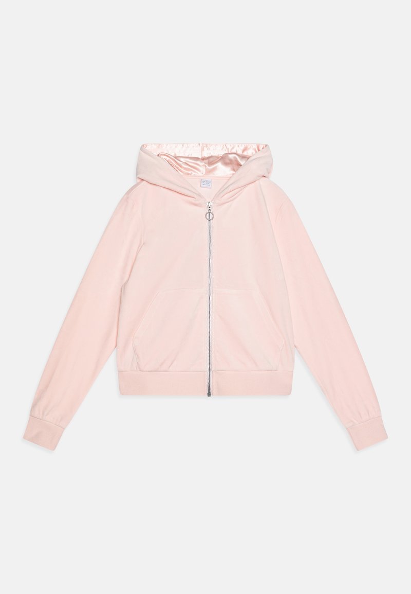 Hoodie rose clair avec une texture douce, fermeture éclair intégrale, capuche avec cordon de serrage, poches avant et poignets élastiques. Accentuée par un intérieur brillant.