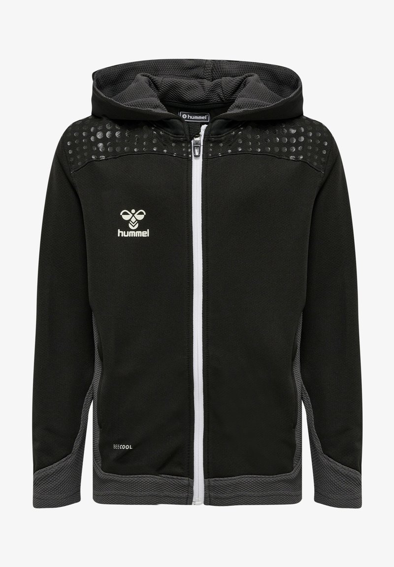 Felpa nera con zip, dettagli grigi, pannelli testurizzati e dettaglio a pois sulle spalle. Presenta una zip bianca e il logo 'hummel' sul petto.