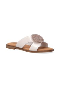 Slide sandal featuring a metallic light pink upper, decorative circular accent, open toe, and flat brown sole. Smooth texture with cut-out design.