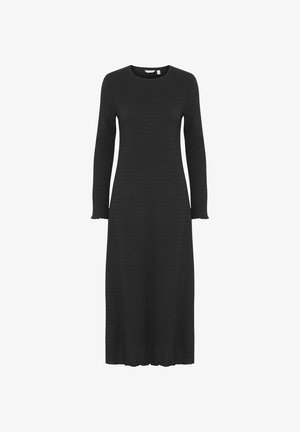 Abito lungo in maglia nera con maniche lunghe, scollatura rotonda, texture a coste e polsini a onde. Lunghezza midi con silhouette dritta.
