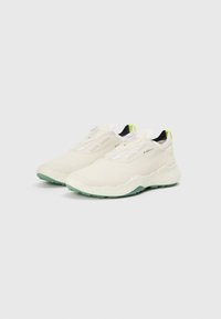Des chaussures de sport légères, de couleur crème, avec une tige texturée, dotées d'un système de laçage blanc et d'une semelle extérieure mint. Accent proposées avec un détail jaune au niveau du talon.