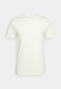 Camiseta de manga corta en algodón color blanco roto, con cuello redondo y un corte relajado. Textura suave, sin patrones ni acentos.