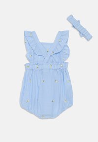 Lys blå rompers med volangstropper og elastisk liv, med broderte gule blader. Inkluderer matchende volanghodebånd.
