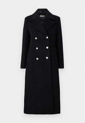 Manteau double boutonnage en mélange de laine noir avec un large col, des boutons argentés, des manches longues et des poches latérales.