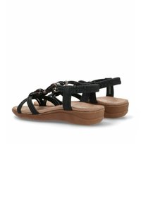Sandalias negras de tiras con material texturizado, con suela de plataforma, acentos elásticos y detalles decorativos de cuentas en las tiras.