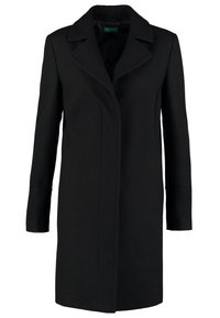 Svart ullrock med slagkrage, långa ärmar och rak skärning. Har sidofickor och en minimalistisk design.