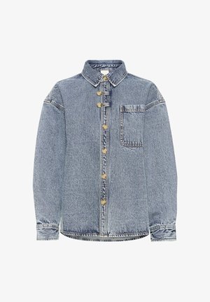 Világos mosott farmer ing, gombos elülső résszel, hegyes gallérral, mellzsebbel és hosszú ujjal. Arany tónusú gombokkal és laza szabással rendelkezik.