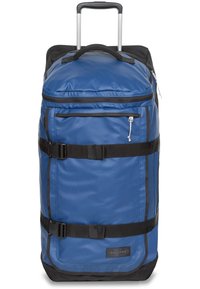 Kestävä sininen nylon-urheilukassi mustilla yksityiskohdilla, jossa on vetäytyvä kahva, ylä- ja sivukahvat sekä säädettävät hihnat.