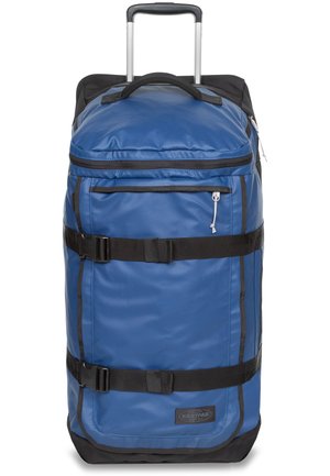 Durable blue nylon duffel bag with black accents, featuring a retractable handle, top and side carry handles, and adjustable straps.