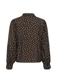 Blouse noire à manches longues à pois blancs, vue de dos. La blouse a un col et une coupe ample avec des poignets froncés.