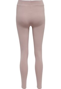 Leggings rosa chiaro realizzati in un tessuto morbido ed elastico, con vita media e design aderente senza cuciture visibili.