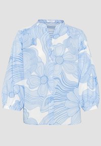 Chemise bleu clair à manches longues avec un motif floral aux contours épais. Manches bouffantes et col mandarin. Tissu lisse et léger.