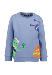 Felpa di colore azzurro chiaro realizzata in tessuto morbido, con tre grafiche di mostri cartoon in verde, blu e arancione, dotati di espressioni giocose e dettagli.