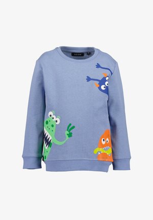 Light blue sweatshirt made of soft fabric featuring three cartoon monster graphics in green, blue, and orange with playful expressions and details.