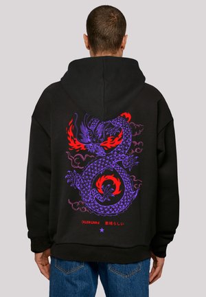 Black hoodie featuring a large purple dragon design with red accents and flames on the back. Made of soft fabric with a relaxed fit.