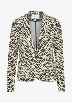 Blazer à motif noir et blanc avec un design géométrique, présentant un col cranté, une fermeture à un bouton et deux poches avant.