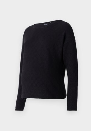Black long-sleeve sweater with a diamond textured pattern, crew neckline, and loose fit. Fabric appears soft and slightly textured.