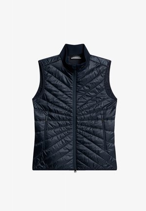 Marineblaue isolierte Weste mit hohem Kragen, gestepptem Muster, frontaler Reißverschluss und zwei Reißverschlusstaschen. Glatte, glänzende Stoffoberfläche.