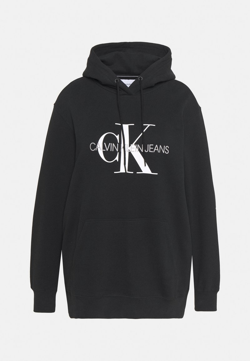 Sweat à capuche noir avec poche frontale, capuche à cordon, et le logo blanc "Calvin Klein Jeans" centré sur la poitrine.