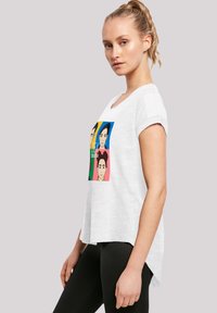 White cotton t-shirt with short rolled sleeves, curved hem, featuring a multicolored graphic of four faces on the front.