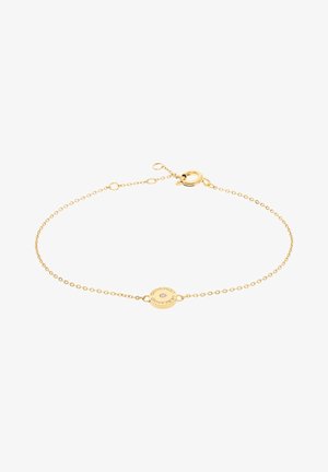 Gold bracelet featuring a delicate chain and a circular disc charm engraved with text. Clasp closure with adjustable length.