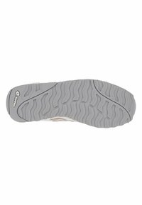 Shoe sole featuring a grey rubber material with a wavy tread pattern, providing traction. The design includes a slight curve towards the toe area.