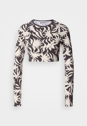 Long-sleeve cropped top in a black and beige floral pattern. Features a round neck and fitted silhouette; made from textured fabric.