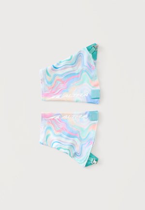 Two colorful, wavy-patterned ankle or wrist gaiters with adjustable teal straps and the word "ALTRA" printed in white.