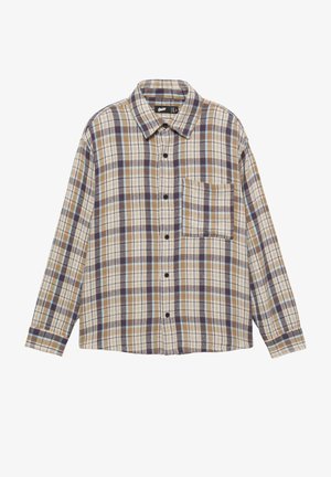 Kostkovaná flanelová košile v barvách světle hnědá, hnědá a modrá. Má zapínání na knoflíky vpředu, límec a jednu náprsní kapsu. Dlouhé rukávy.