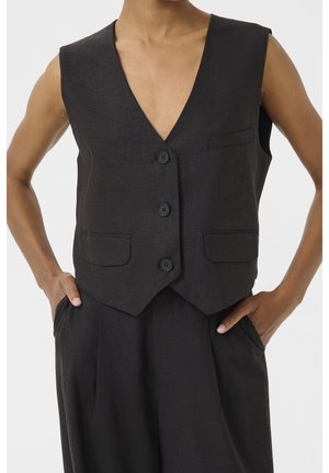 Sleeveless dark gray buttoned vest with three buttons, two front flap pockets, paired with matching high-waisted pants, hands in pockets.