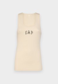 Débardeur beige en tissu côtelé, avec un col rond et un design sans manches. Logo "GAP" en gris foncé sur la poitrine.