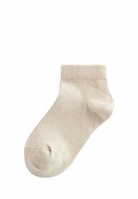 Beige bomuldsankelsok med ribbet manchet og glat tekstur. Har en afrundet tå og sømløst design for komfort.