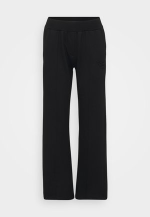 Black sweatpants featuring a wide-legged design, elastic waistband, and an embossed logo on the left leg. Smooth texture and minimalist style.
