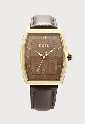 Rectangular gold-framed wristwatch with brown textured face, gold Roman numerals, gold hands, date window at six, and dark brown leather strap.