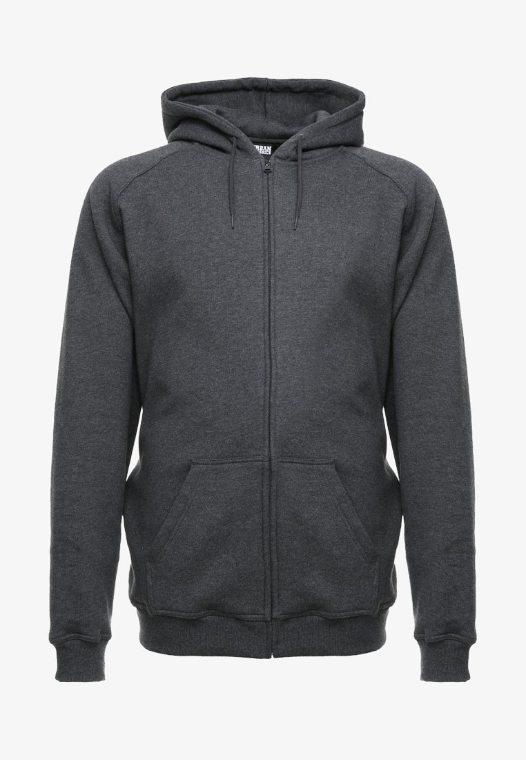 Sudadera gris con cremallera, capucha con cordón, bolsillos frontales y puños acanalados. Fabricada con un tejido suave y texturizado.