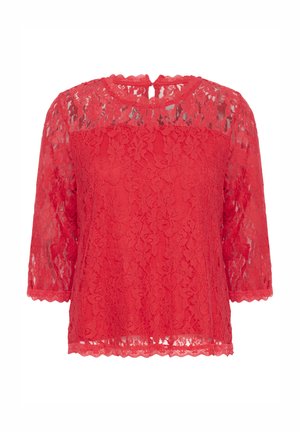 Top rosso in pizzo con maniche a tre quarti, bordi scallopati e design con apertura a chiave sul retro. Presenta motivi floreali su tutto il tessuto.