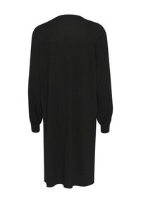 Il vestito in maglione nero presenta maniche lunghe e voluminose, un collo rotondo e una vestibilità rilassata che arriva sotto il ginocchio, realizzato in morbido materiale knit.
